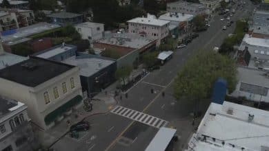 Plan for protected bike lanes alongside Oakland’s Grand Avenue elevating crimson flags for companies